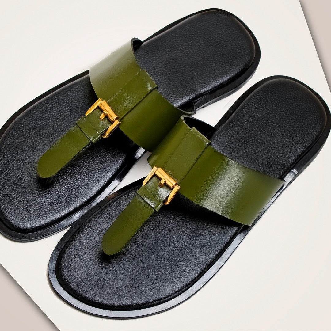 A pair of Detail Africa's RUKI Slipper slide sandals with wide olive green straps and gold-tone buckle details, set against a clean off-white background.