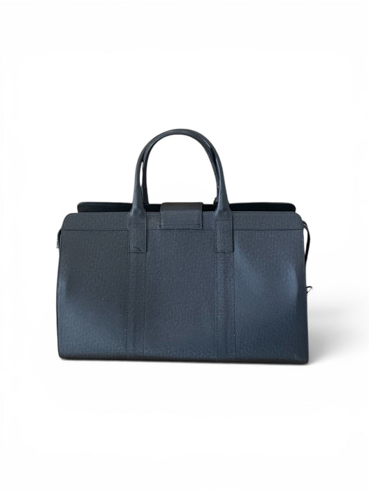 a back view of the textured leather duffel bag with double top handles