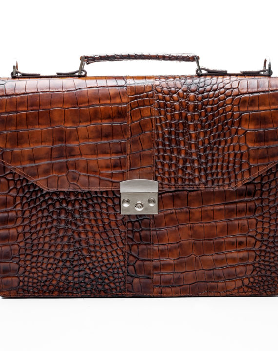 The Handcrafted Naju Leather Briefcase is the perfect briefcase for the contemporary working-class man with sharp and defined edges. It features double internal compartments that can fit a 13″-15″ laptop, back zip, and detachable strap. It fits different office items like a notebook or notepad, office files documents, ATM cards, ID Cards, and business cards. The briefcase has internal compartments to fit in a pen and smaller items also. It’s 100% genuine leather, has double internal compartments, back-zip, detachable and adjustable strap. It combines features of style and functionality while creating the perfect statement piece for the business or working-class man or woman. Our Black Naju Leather Briefcase is your go-to partner for working-class men, businessmen, and professionals. It is a “MUST get” item for those who want to steal the show at any event. this briefcase or use it as a gift item for your clients and loved ones. It is also be used for corporate and individual gift packages. For custom quotes, send us a mail at info@detailafrica.com with your requests and we would definitely get back to you.